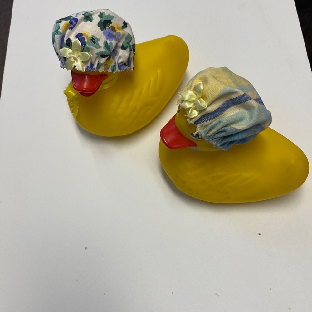 2 Dandelion rubber ducks with decorative caps